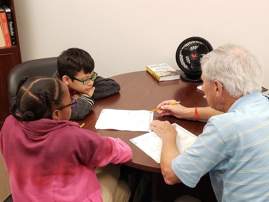 GYAC volunteer tutors students in math